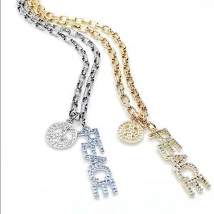 Alexa Rae gold peace necklace